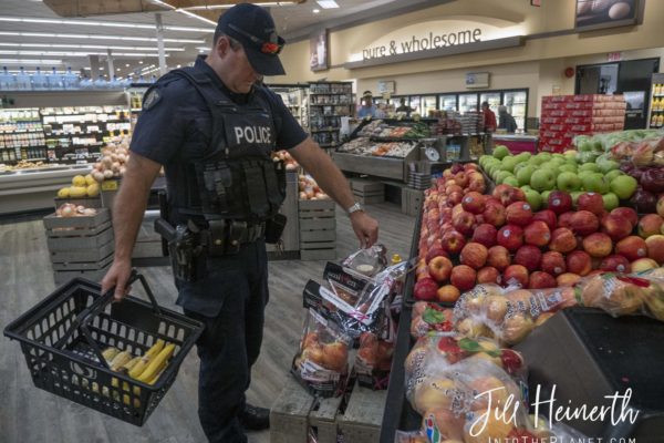 Constable Mike Reid makes a grocery stop to stock the boat for a week-long patrol.