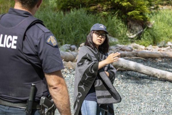 Haida Guardian Jessica offers a tour of cultural resources at Sgaan Gwaii, Haida Gwaii.