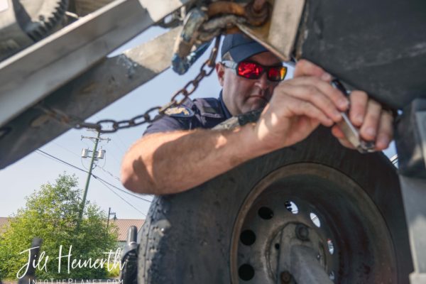 Constable Mike Reid repairs a broken cleat on the front of the RHIB.