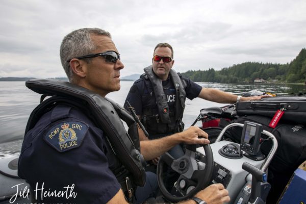 Constables Russ Warren and Mike Reid shuttle gear to the PV Inkster, their home for the next week.